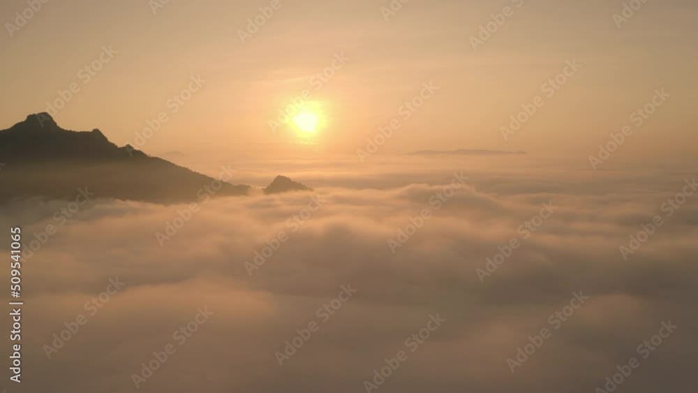 Drone flight over the clouds during sunrise. Golden hour and amazing sun rays, beautiful cloudscape. Picturesque time lapse of white fluffy clouds moving softly on cloudy, misty weather. Drone flight over the clouds during sunrise. Golden hour and amazing sun rays, beautiful cloudscape. Picturesque time lapse of white fluffy clouds moving softly on cloudy, misty weather.
