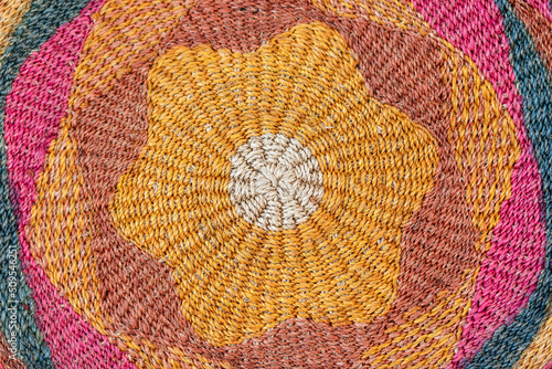 Texture of jute knitted rug (carpet) with characteristic traditional saturated colors