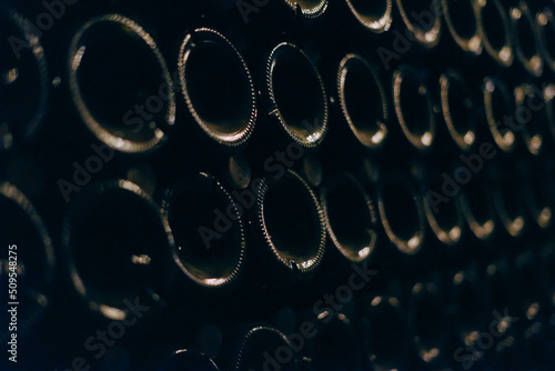 Green bottles of wine or champagne. Champagne production.