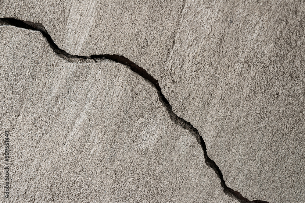 Diagonal crack in plaster on a wall