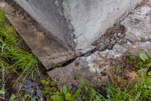 Slika na platnu Destruction of cement foundation and blind area of building as result of exposur