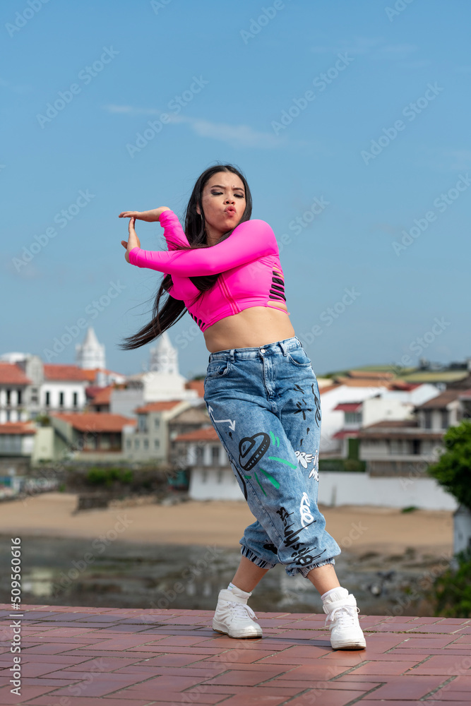 Young latin girl dancing in the street, Panama - stock photo