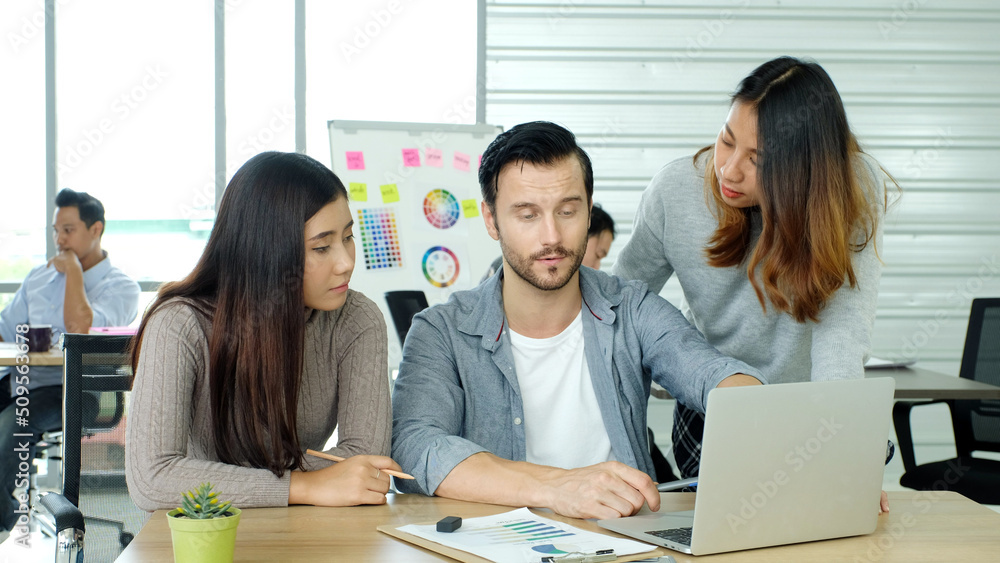 Obraz premium Creative team discussing about work at office, Small bussiness teamwork planing business strategy, office life