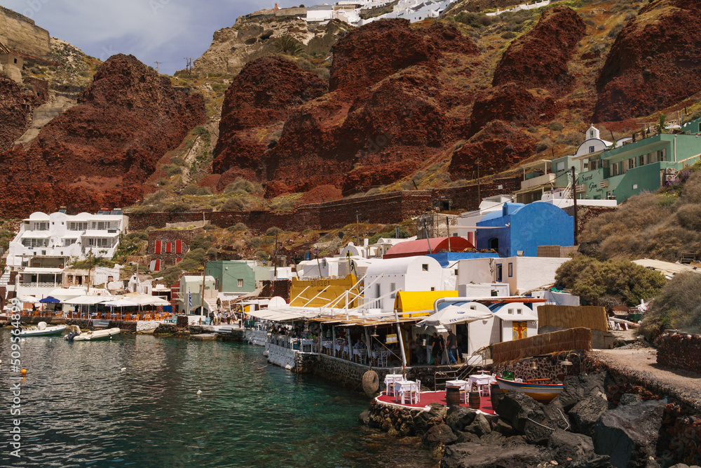 Port Amoudi in the town of Oia, Santorini. Landscape photo of the colourful landscape at buildings at the old port.