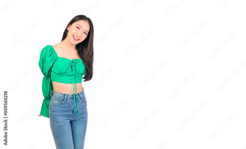 Attractive beautiful positive happy smile asian woman hands point up and pose with empty space wearing green shirt and jeans. Attractive beautiful positive happy smile asian woman hands point up and pose with empty space wearing green shirt and jeans.