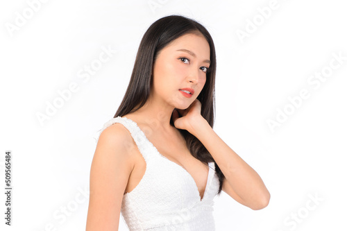 Portrait of young beautiful sexy asian woman wearing a white dress pose with empty space. © HappyTime 17
