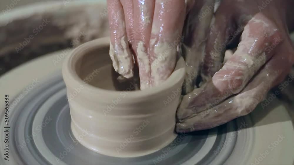 Traditional Pottery Making, Close Up Of Potter's Hands Shaping A Bowl Traditional Pottery Making, Close Up Of Potter's Hands Shaping A Bowl