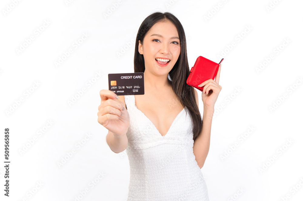 Portrait of young beautiful sexy asian woman happy holding a wallet and credit card in hand, payment credit card money and financial lifestyle concept . Portrait of young beautiful sexy asian woman happy holding a wallet and credit card in hand, payment credit card money and financial lifestyle concept .