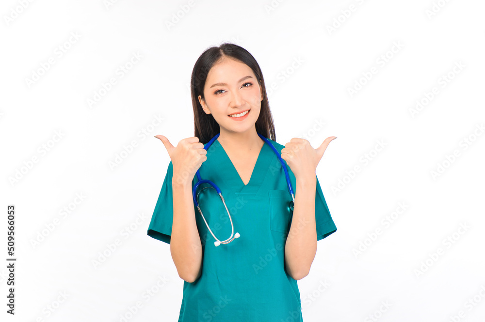 Portrait of professional confident young asian female smiling doctor in green scrubs hands pointing showing thumbs up, presenting with copy space, doctor healthcare and doctors concept. Portrait of professional confident young asian female smiling doctor in green scrubs hands pointing showing thumbs up, presenting with copy space, doctor healthcare and doctors concept.