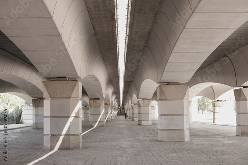 Fotobehang concrete corridor under the bridge, architecture perspective