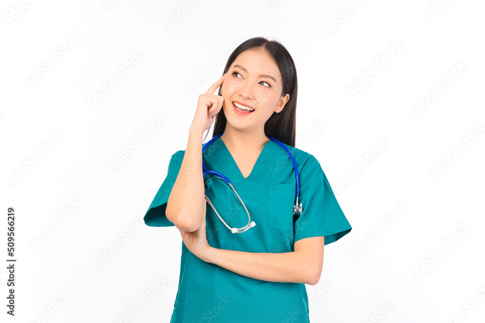 Portrait of professional confident young asian female smiling doctor in green scrubs standing thinking to empty space, doctor healthcare and doctors concept. Portrait of professional confident young asian female smiling doctor in green scrubs standing thinking to empty space, doctor healthcare and doctors concept.