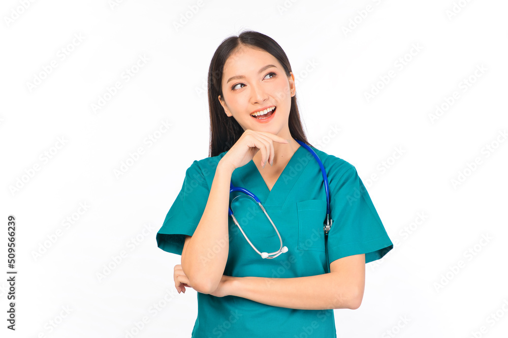 Portrait of professional confident young asian female smiling doctor in green scrubs standing thinking to empty space, doctor healthcare and doctors concept. Portrait of professional confident young asian female smiling doctor in green scrubs standing thinking to empty space, doctor healthcare and doctors concept.