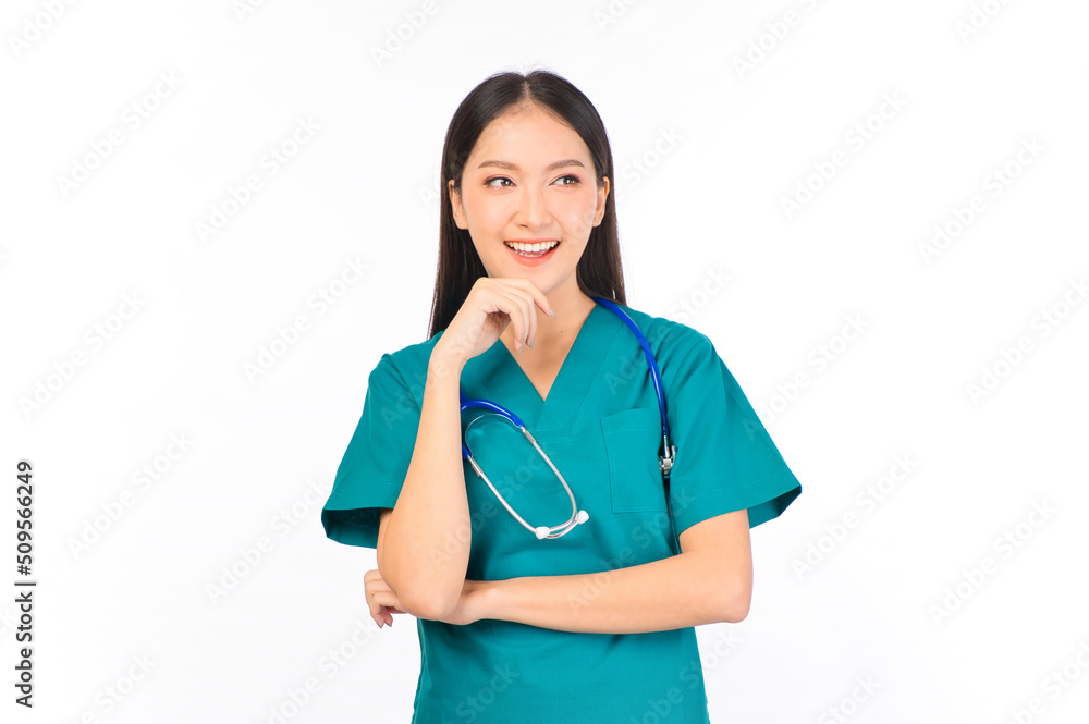Portrait of professional confident young asian female smiling doctor in green scrubs standing thinking to empty space, doctor healthcare and doctors concept. Portrait of professional confident young asian female smiling doctor in green scrubs standing thinking to empty space, doctor healthcare and doctors concept.