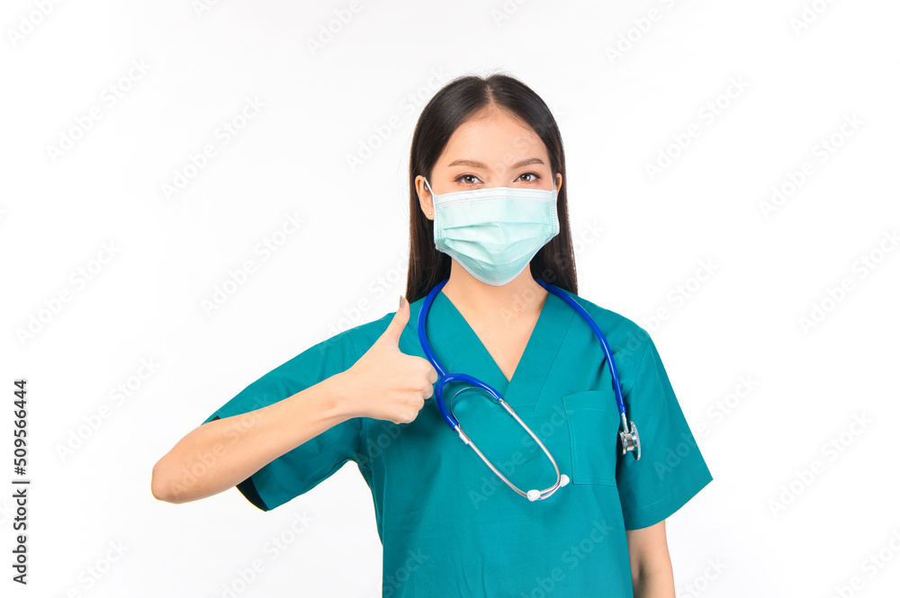 Portrait of professional confident young asian female smiling doctor in green scrubs protection flu cold facial mask showing presenting finger to stop talking sign gesture silence and secret concept. Portrait of professional confident young asian female smiling doctor in green scrubs protection flu cold facial mask showing presenting finger to stop talking sign gesture silence and secret concept.
