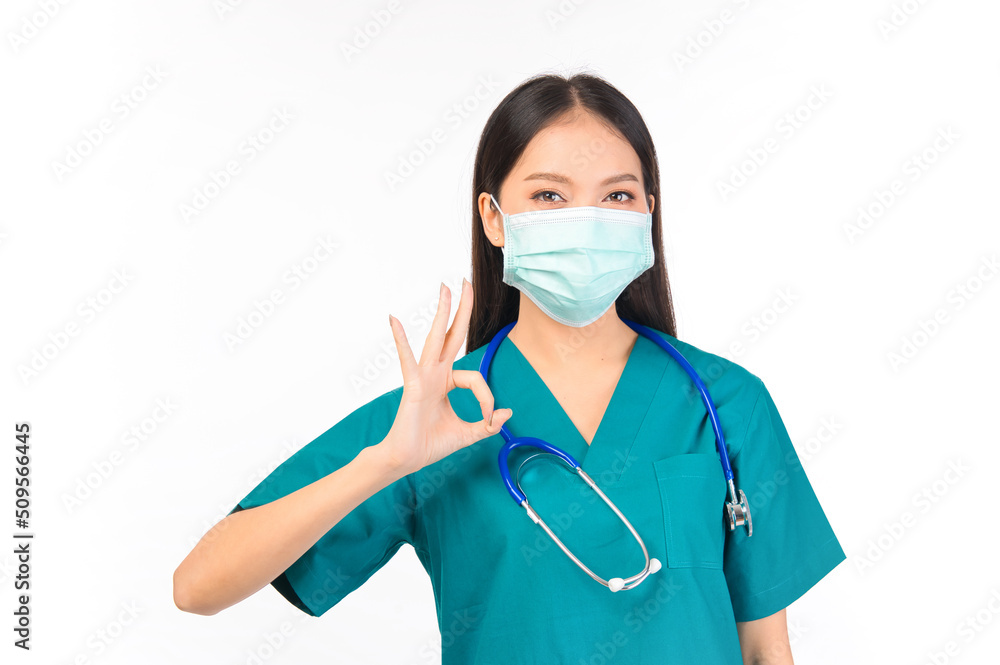Portrait of professional confident young asian female smiling doctor in green scrubs showing OK sign gesture , doctor healthcare and doctors concept. Portrait of professional confident young asian female smiling doctor in green scrubs showing OK sign gesture , doctor healthcare and doctors concept.