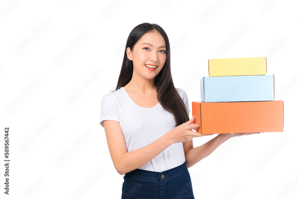 Happy cute asian woman smiling and holding package online marketing and delivery Start a small business at home on white background, Delivery shipping service concept. Happy cute asian woman smiling and holding package online marketing and delivery Start a small business at home on white background, Delivery shipping service concept.