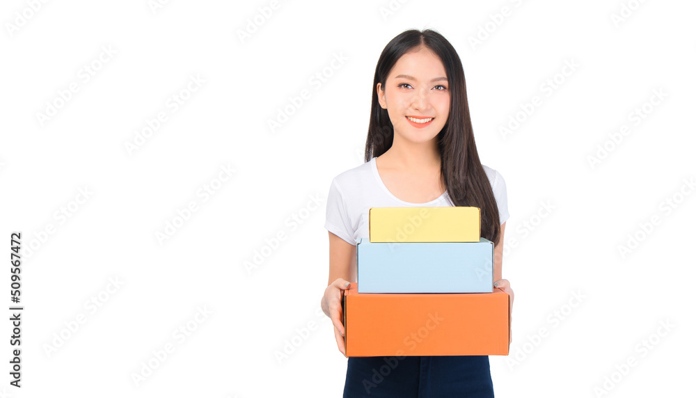 Happy cute asian woman smiling and holding package online marketing and delivery Start a small business at home on white background, Delivery shipping service concept. Happy cute asian woman smiling and holding package online marketing and delivery Start a small business at home on white background, Delivery shipping service concept.