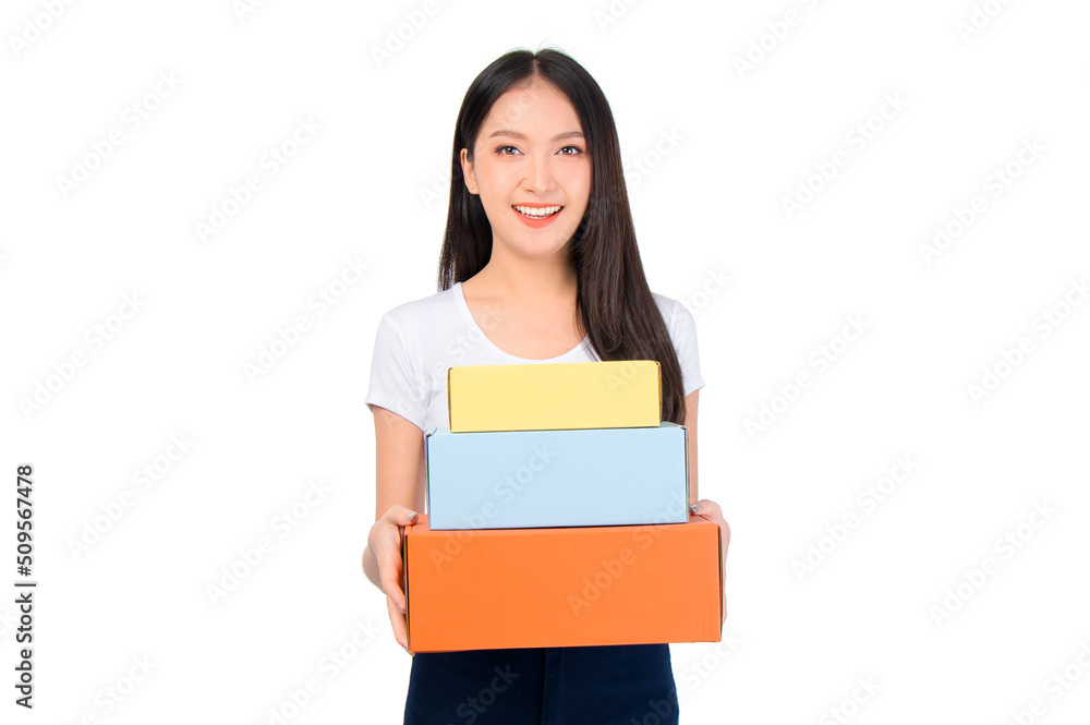 Happy cute asian woman smiling and holding package online marketing and delivery Start a small business at home on white background, Delivery shipping service concept.