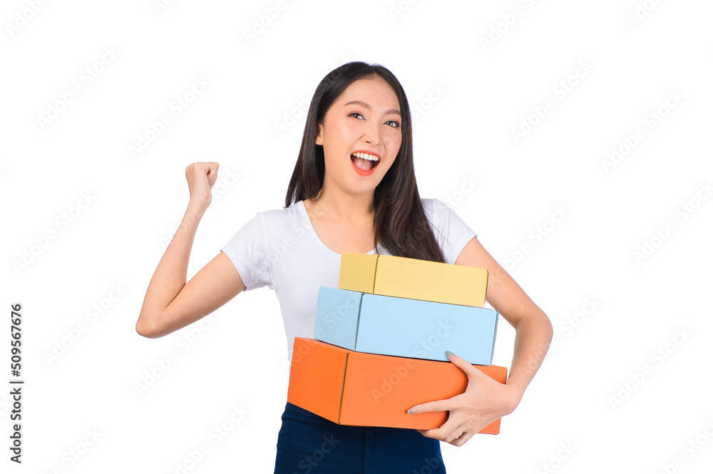 Happy cute asian woman smiling and holding package online marketing and delivery Start a small business at home on white background, Delivery shipping service concept. Happy cute asian woman smiling and holding package online marketing and delivery Start a small business at home on white background, Delivery shipping service concept.
