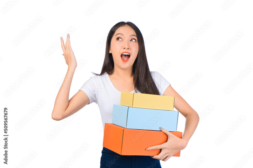 Happy cute asian woman smiling and holding package online marketing and delivery Start a small business at home on white background, Delivery shipping service concept. Happy cute asian woman smiling and holding package online marketing and delivery Start a small business at home on white background, Delivery shipping service concept.