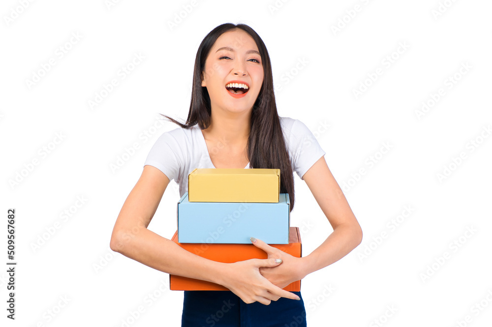 Happy cute asian woman smiling and holding package online marketing and delivery Start a small business at home on white background, Delivery shipping service concept. Happy cute asian woman smiling and holding package online marketing and delivery Start a small business at home on white background, Delivery shipping service concept.