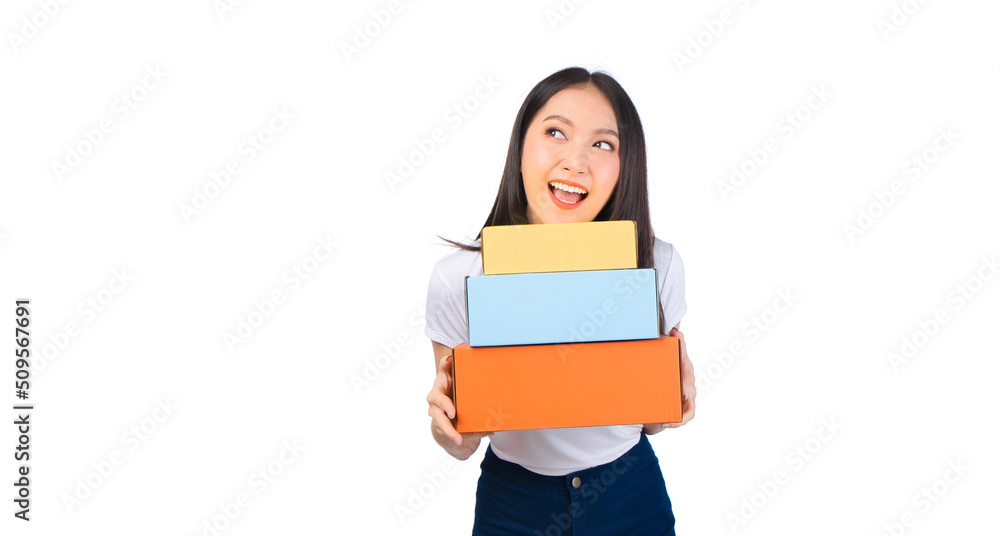 Happy cute asian woman smiling and holding package online marketing and delivery Start a small business at home on white background, Delivery shipping service concept. Happy cute asian woman smiling and holding package online marketing and delivery Start a small business at home on white background, Delivery shipping service concept.