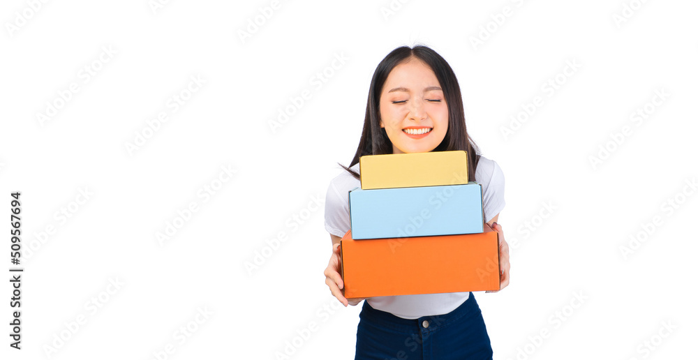 Happy cute asian woman smiling and holding package online marketing and delivery Start a small business at home on white background, Delivery shipping service concept.