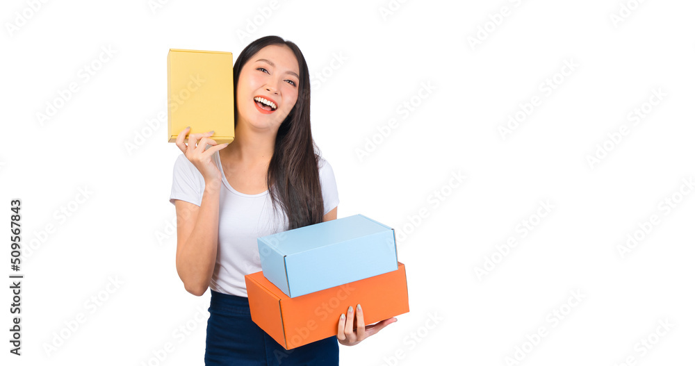 Happy cute asian woman smiling and holding package online marketing and delivery Start a small business at home on white background, Delivery shipping service concept. Happy cute asian woman smiling and holding package online marketing and delivery Start a small business at home on white background, Delivery shipping service concept.