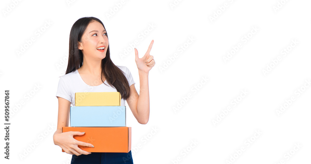 Happy cute asian woman smiling and holding package online marketing and delivery Start a small business at home on white background, Delivery shipping service concept. Happy cute asian woman smiling and holding package online marketing and delivery Start a small business at home on white background, Delivery shipping service concept.