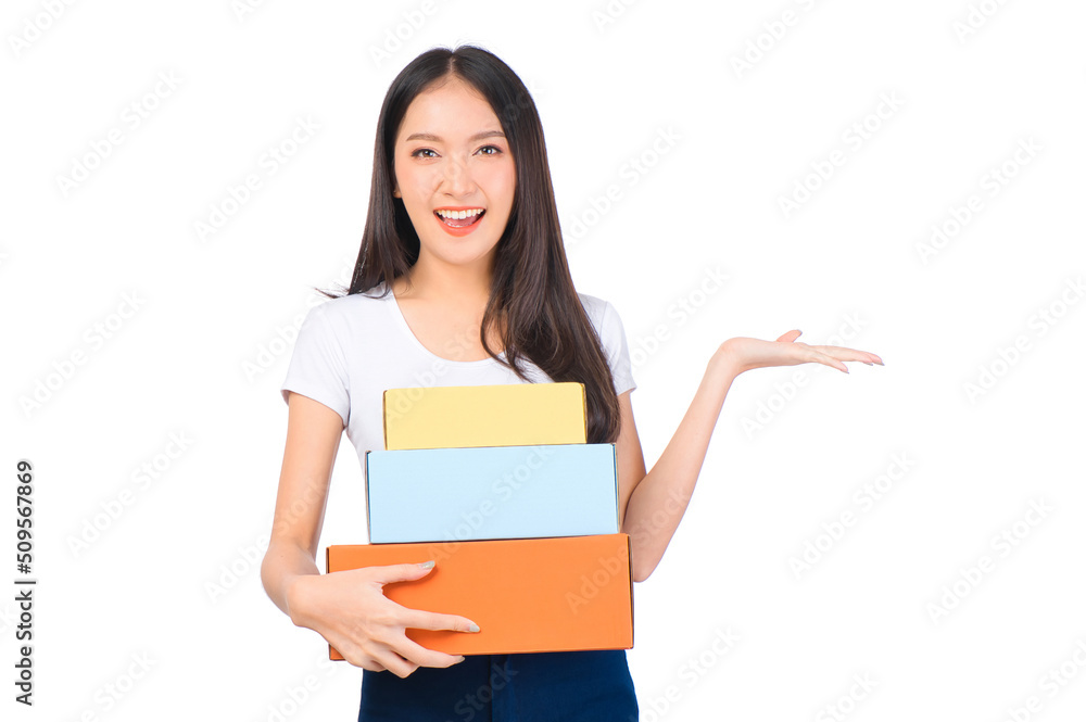 Happy cute asian woman smiling and holding package online marketing and delivery Start a small business at home on white background, Delivery shipping service concept. Happy cute asian woman smiling and holding package online marketing and delivery Start a small business at home on white background, Delivery shipping service concept.