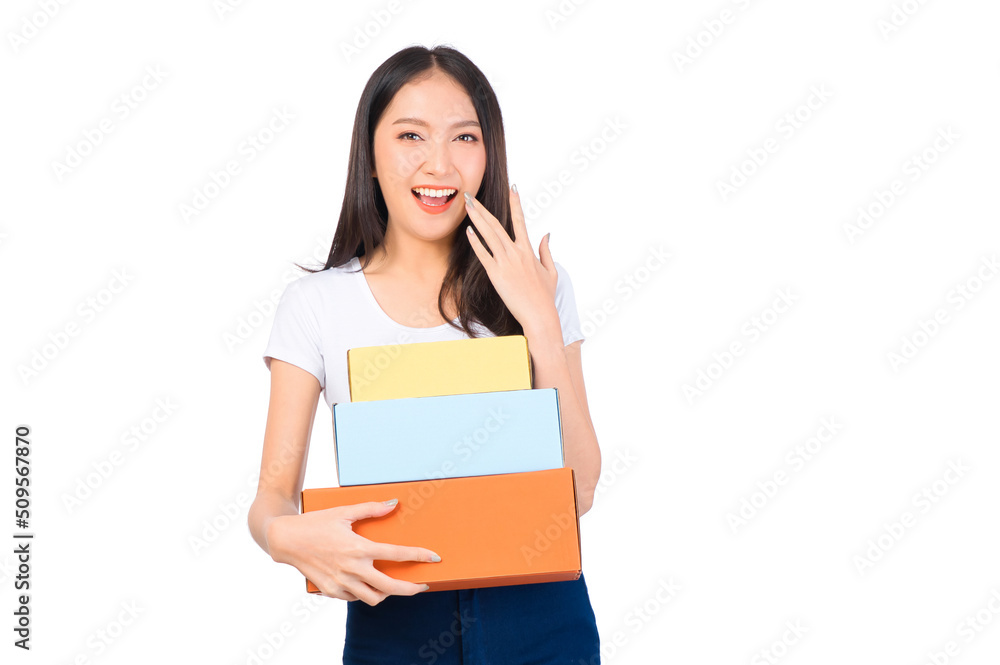 Happy cute asian woman smiling and holding package online marketing and delivery Start a small business at home on white background, Delivery shipping service concept. Happy cute asian woman smiling and holding package online marketing and delivery Start a small business at home on white background, Delivery shipping service concept.
