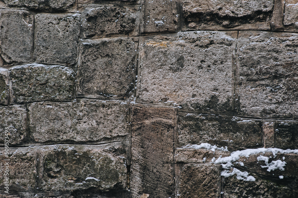 Texture of grunge stone wall. Natural surface. Background of old large gray sandstone and granite blocks. Texture of grunge stone wall. Natural surface. Background of old large gray sandstone and granite blocks.