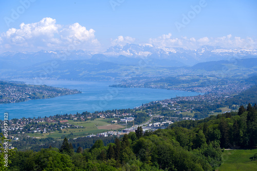 Aerial view of Lake Zürich and Canton Zürich with the Swiss Alps in the background seen from local mountain Uetliberg on a sunny spring day. Photo taken May 18th, 2022, Zurich, Switzerland.