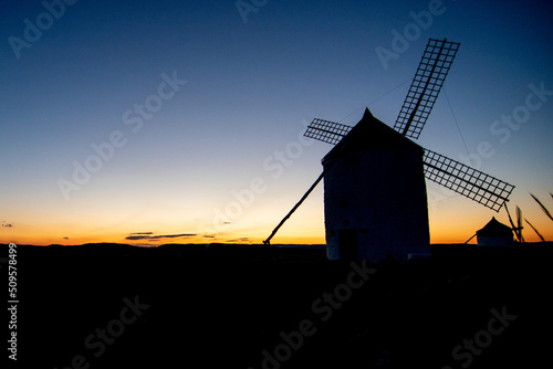 Windmills of Consuegra in the province of Toledo during a sunset with a clear summer day