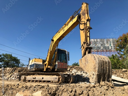 A macho car parked on a pile of dirt