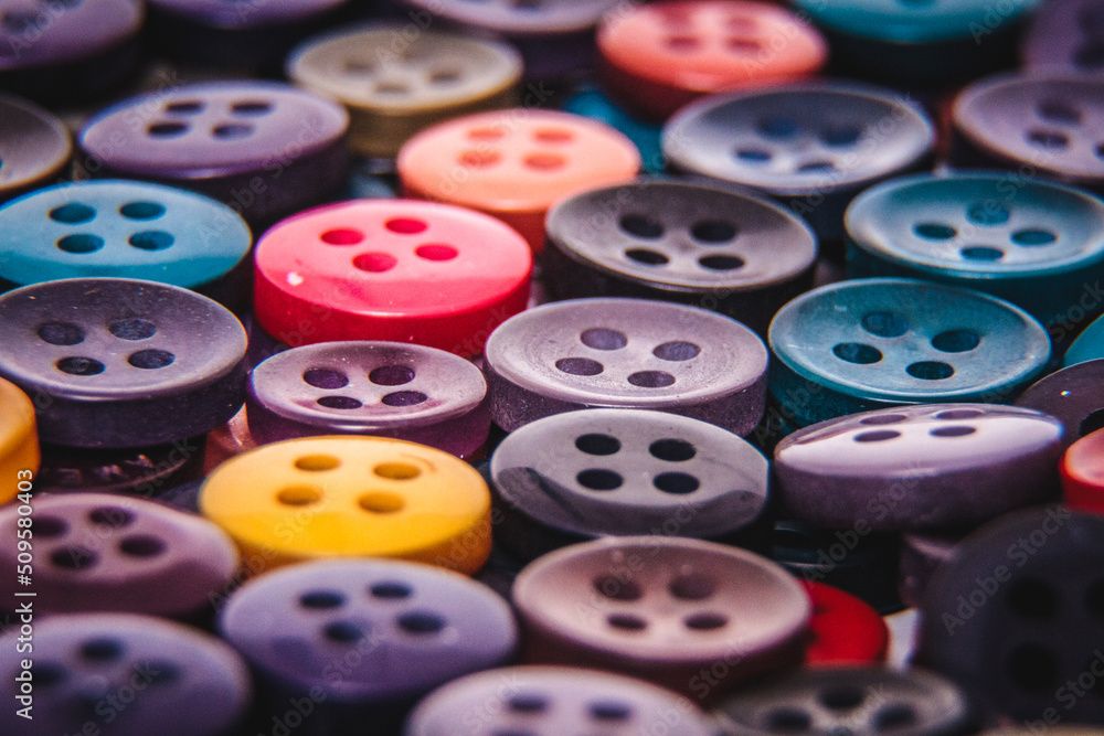 Colourful Buttons used in textile or apparel factory. Different colour buttons placed one over the other. Colourful Buttons used in textile or apparel factory. Different colour buttons placed one over the other.