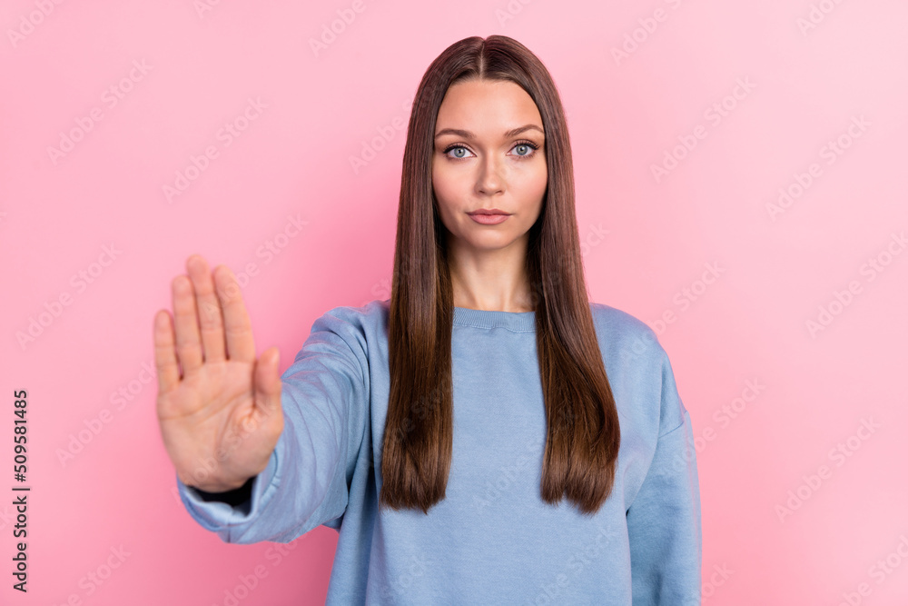 Portrait of attractive content girl showing palm stop decision refusal isolated over pink pastel color background Portrait of attractive content girl showing palm stop decision refusal isolated over pink pastel color background