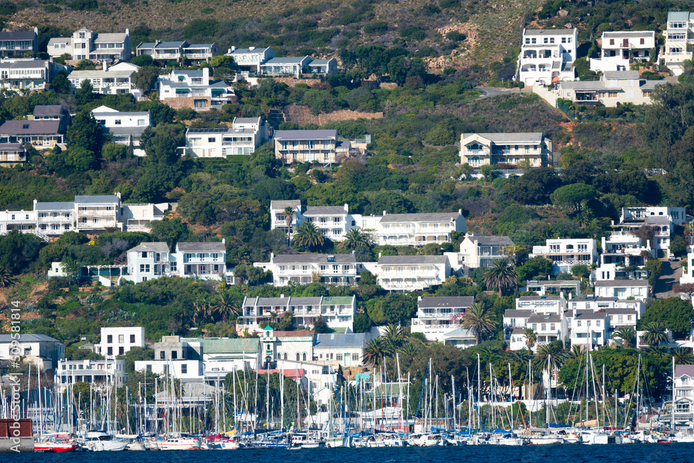 Simon's Town houses or buildings on mountainside with marina and yachts below