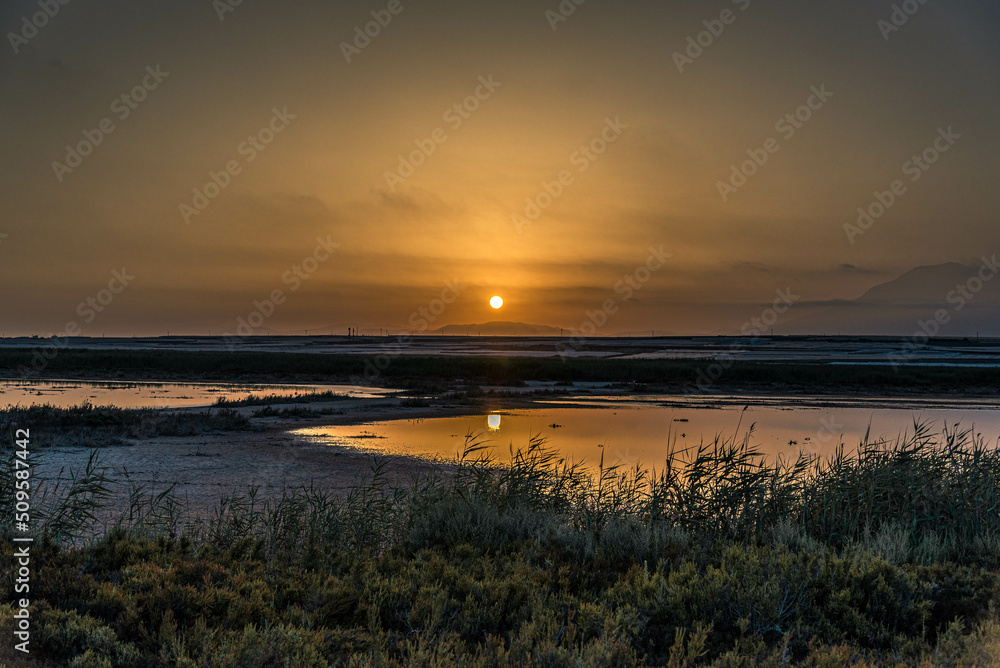 Sunset in the salt flats of Roquetas del Mar, Almeria, Spain.