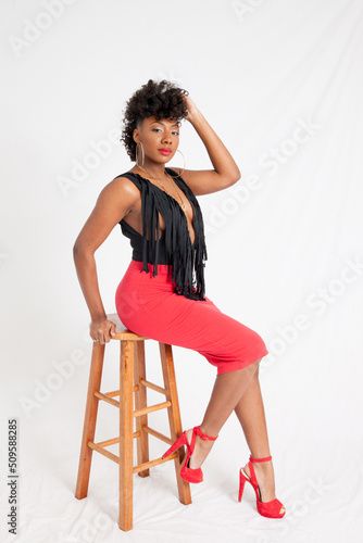 Lovely black woman sitting thoughtfully © Allen Penton