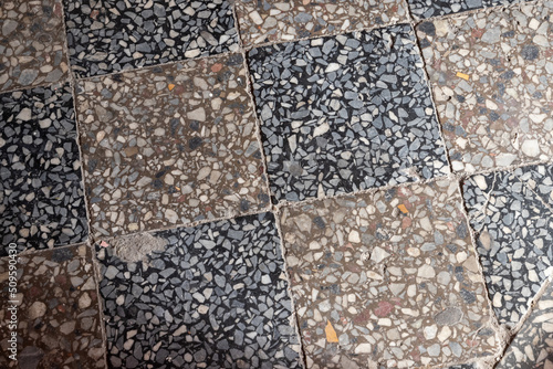 Old damaged tiling on the floor, retro style