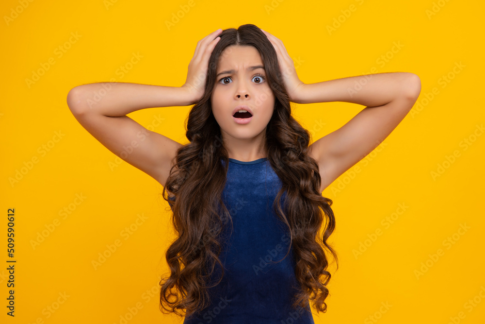 Fototapeta premium Angry teenager girl, upset and unhappy negative emotion. Studio portrait of sadness anger teen. Portrait of a very mad and upset child.