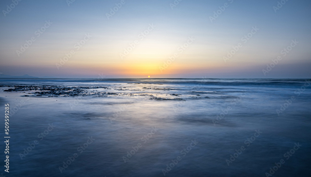 Sunrise in the waters of Guardamar del Segura beach, Alicante, Spain. Sunrise in the waters of Guardamar del Segura beach, Alicante, Spain.
