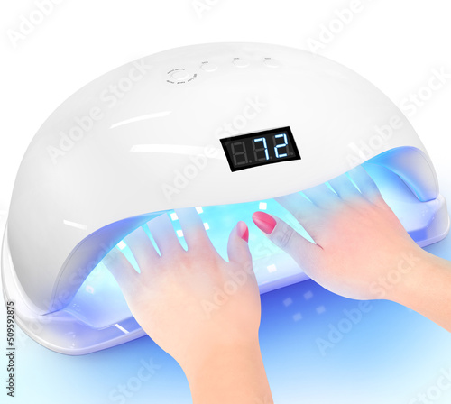 Nail lamp Polish Dryer. Female using shellac uv led lamp.A young woman at manicure procedure UV lamp for drying shellac on nails Manicure and gel nail Polish uv light. Hand in uv nail lamp blue light