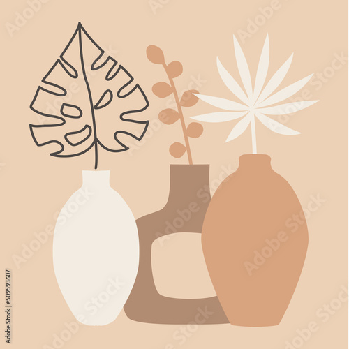 Palm leaves, monstera leaves and leaves of ornamental plants in a vase. Exotic tropical composition on beige background