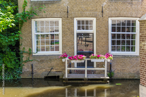 Balcony with colorful flowers at the museum cafe in Gouda, Netherlands photo