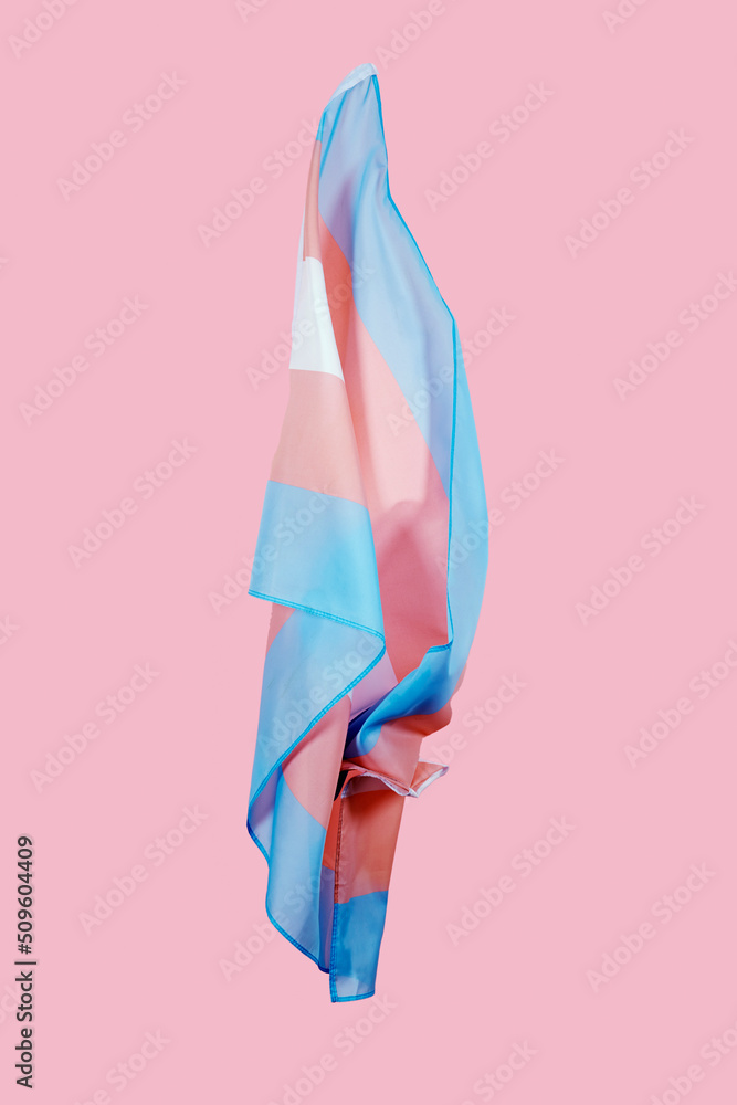transgender pride flag waving on a pink background - obrazy, fototapety, plakaty 