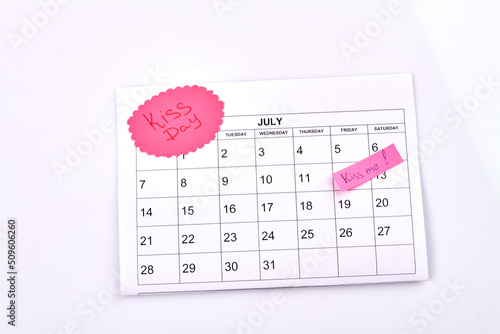 July calendar and kiss day celebration concept. Isolated on white background. photo