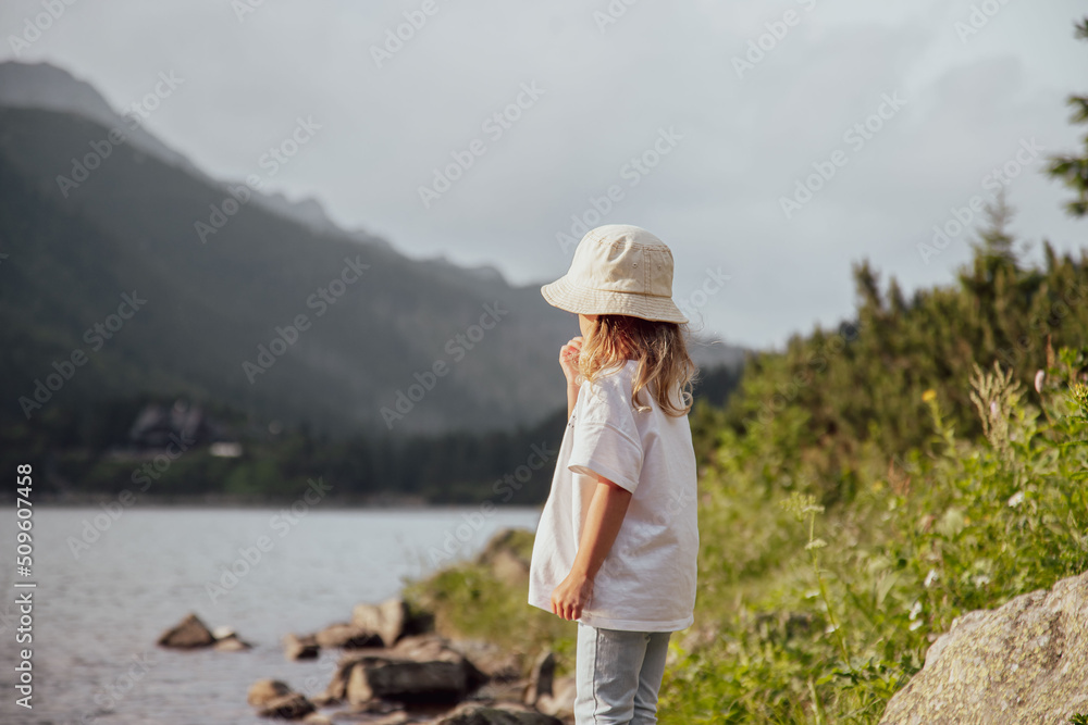 child in mountains at Morskie Oko lake near Zakopane, Tatra Mountains, Poland