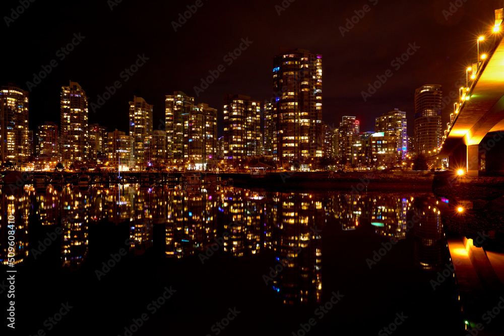 Cambie Bridge and Yaletown Lights Vancouver. The view of Yaletown across False Creek at night framed by the Cambie Bridge in Vancouver. British Columbia, Canada.

